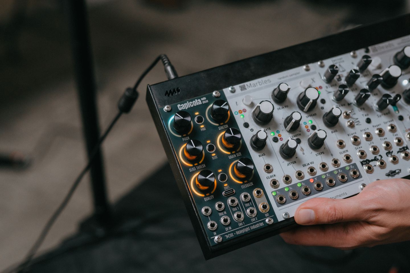 Capicola running in a portable Eurorack case held in one hand