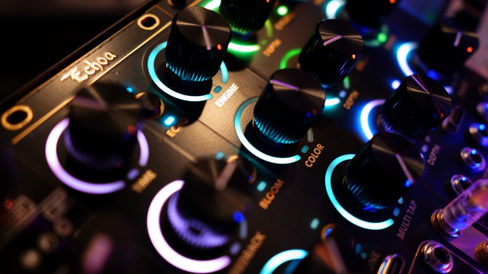 Closeup of the Echoa stereo dual-delay Eurorack module with lit LED rings around its aluminum knobs