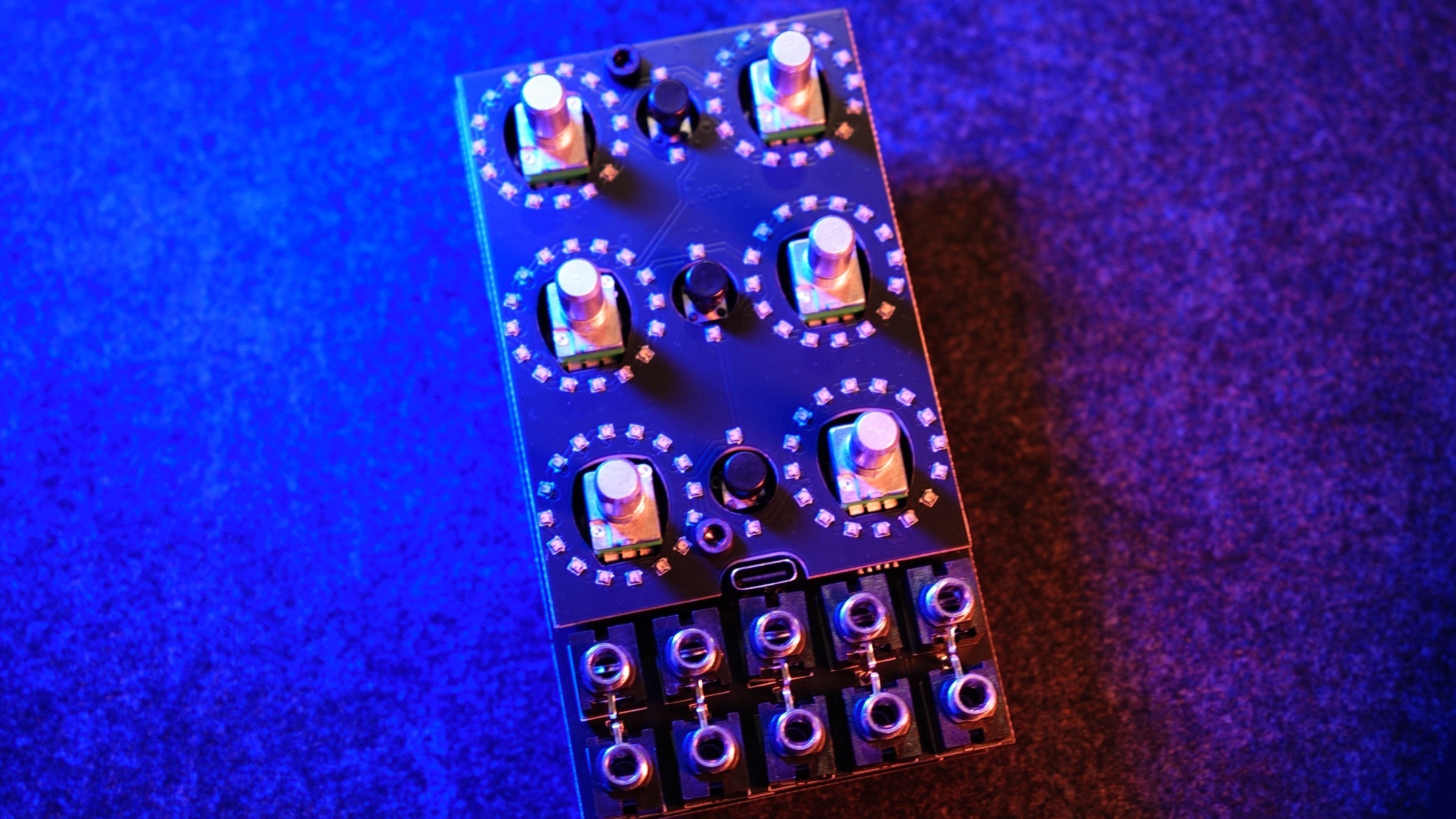 Bare Alchemy Lab circuit board without its panel, showing the two jack rows at the bottom, six LED-ringed pot positions, and the front USB-C port